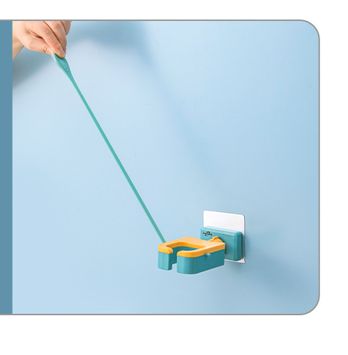 Wall-mounted hair dryer rack with adjustable silicone fixing belt, designed for convenient storage and organization in modern bathrooms.