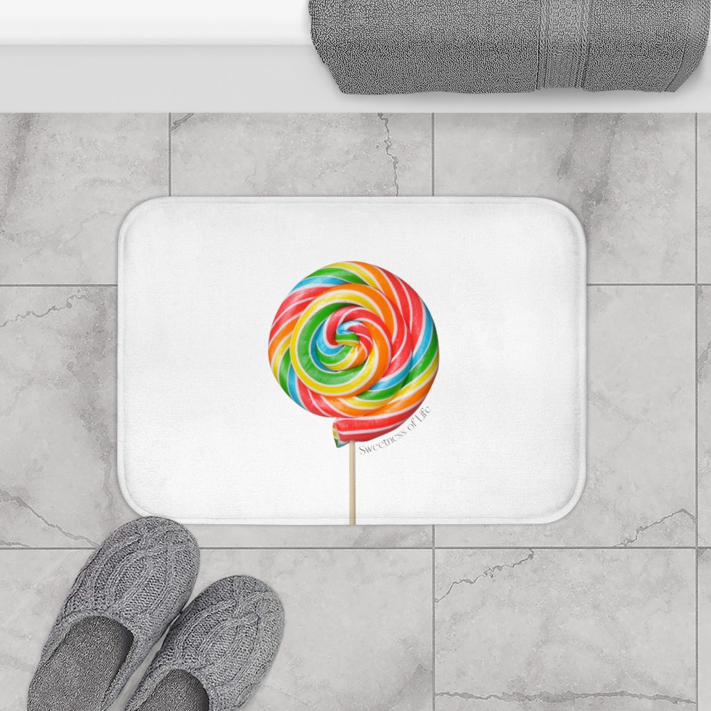 Lollipop Sweetness of Life Message Bath Mat in white with colorful lollipop design, featuring anti-slip backing and plush microfiber material.