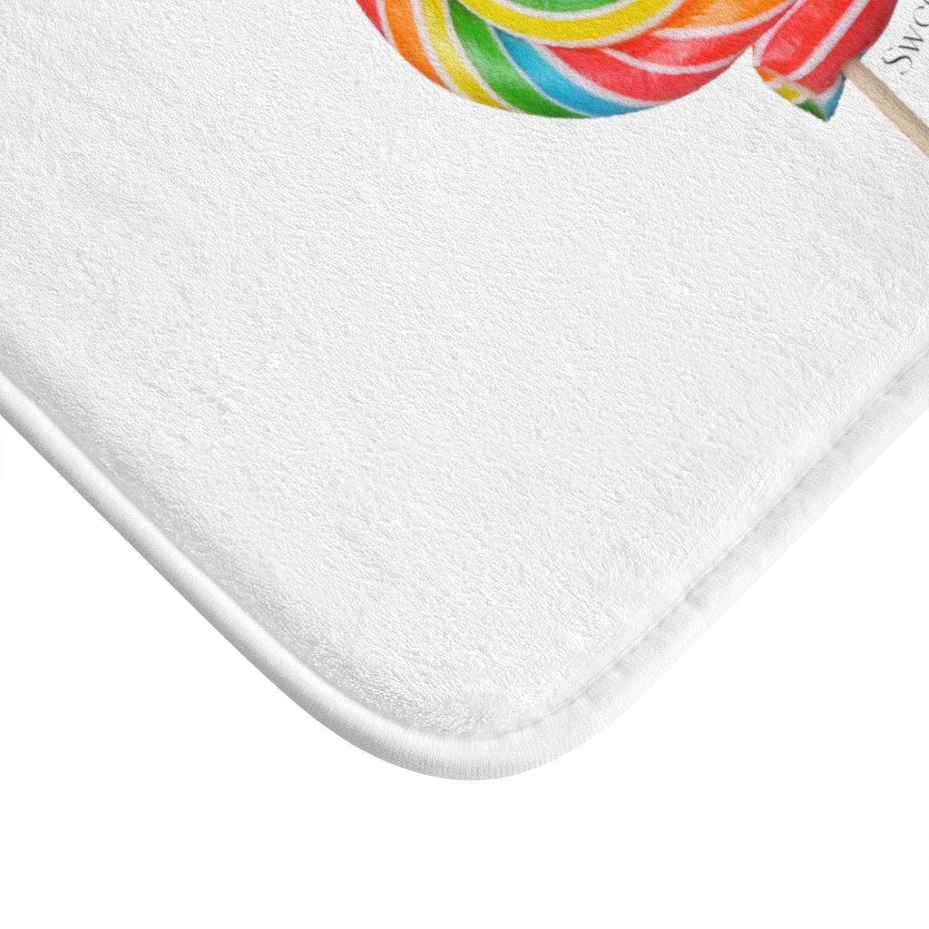 Lollipop Sweetness of Life Message Bath Mat in white with colorful lollipop design, featuring anti-slip backing and plush microfiber material.