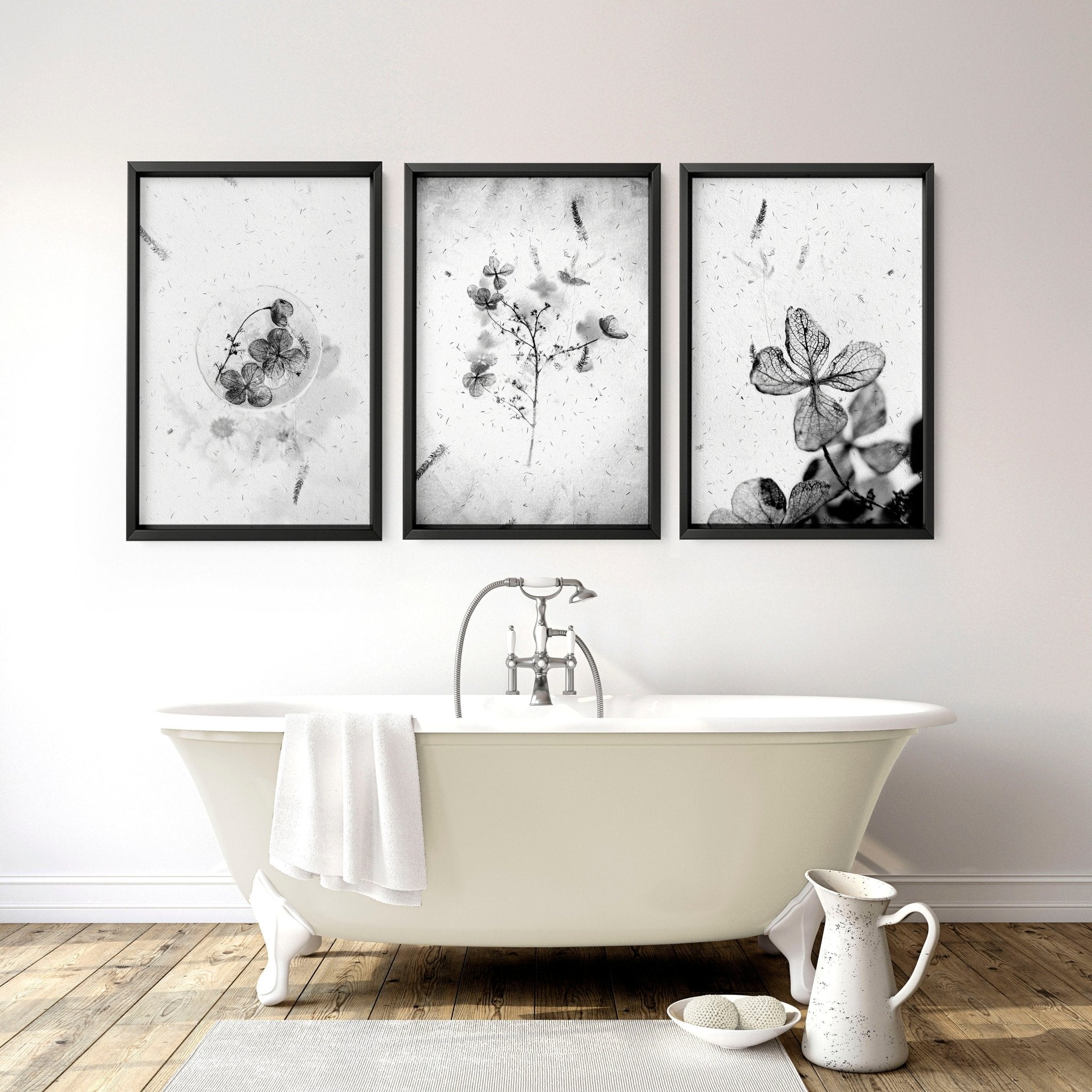 Set of 3 modern botanical wall art prints in grey, white, and black, designed for bathroom decor.