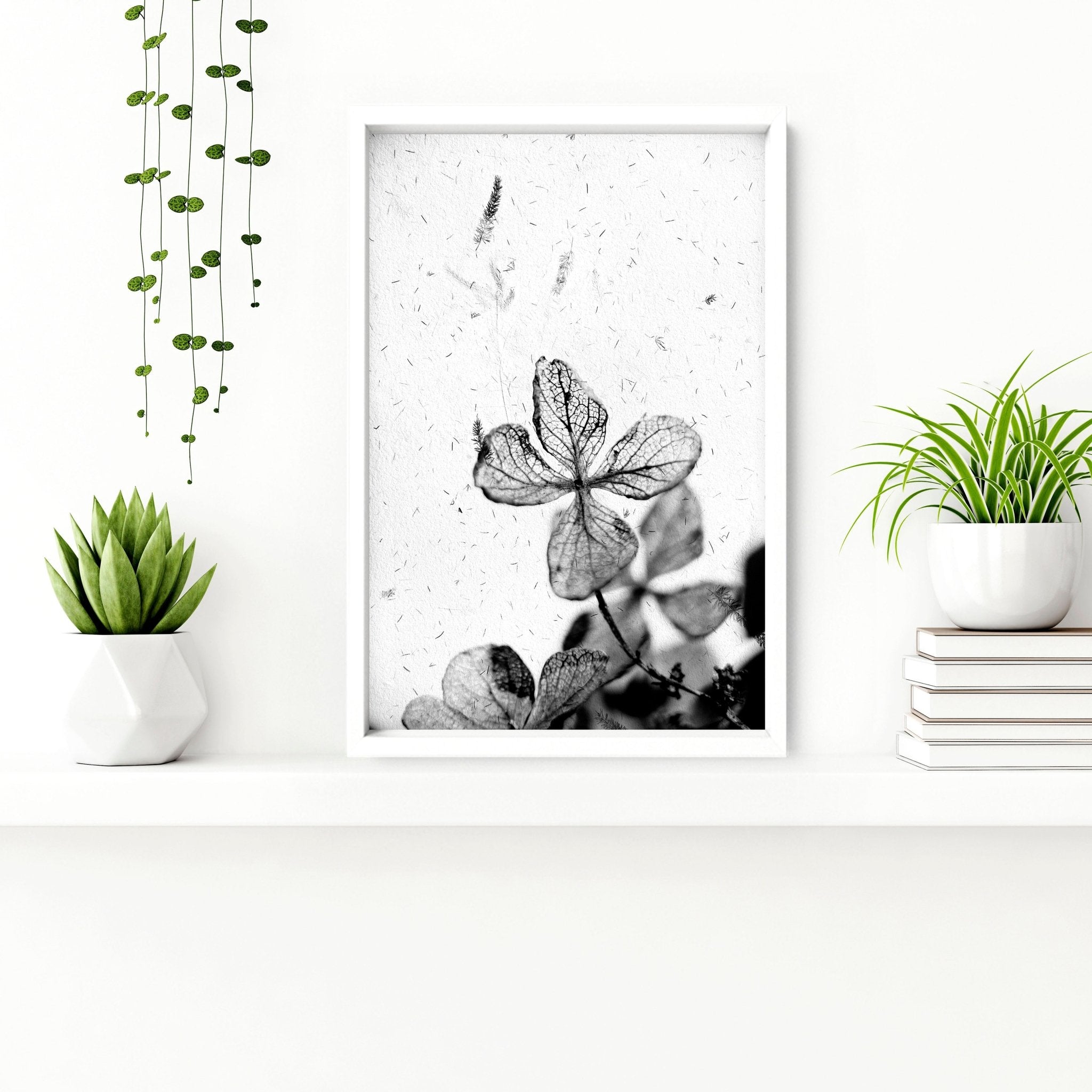 Set of 3 modern botanical wall art prints in grey, white, and black, designed for bathroom decor.