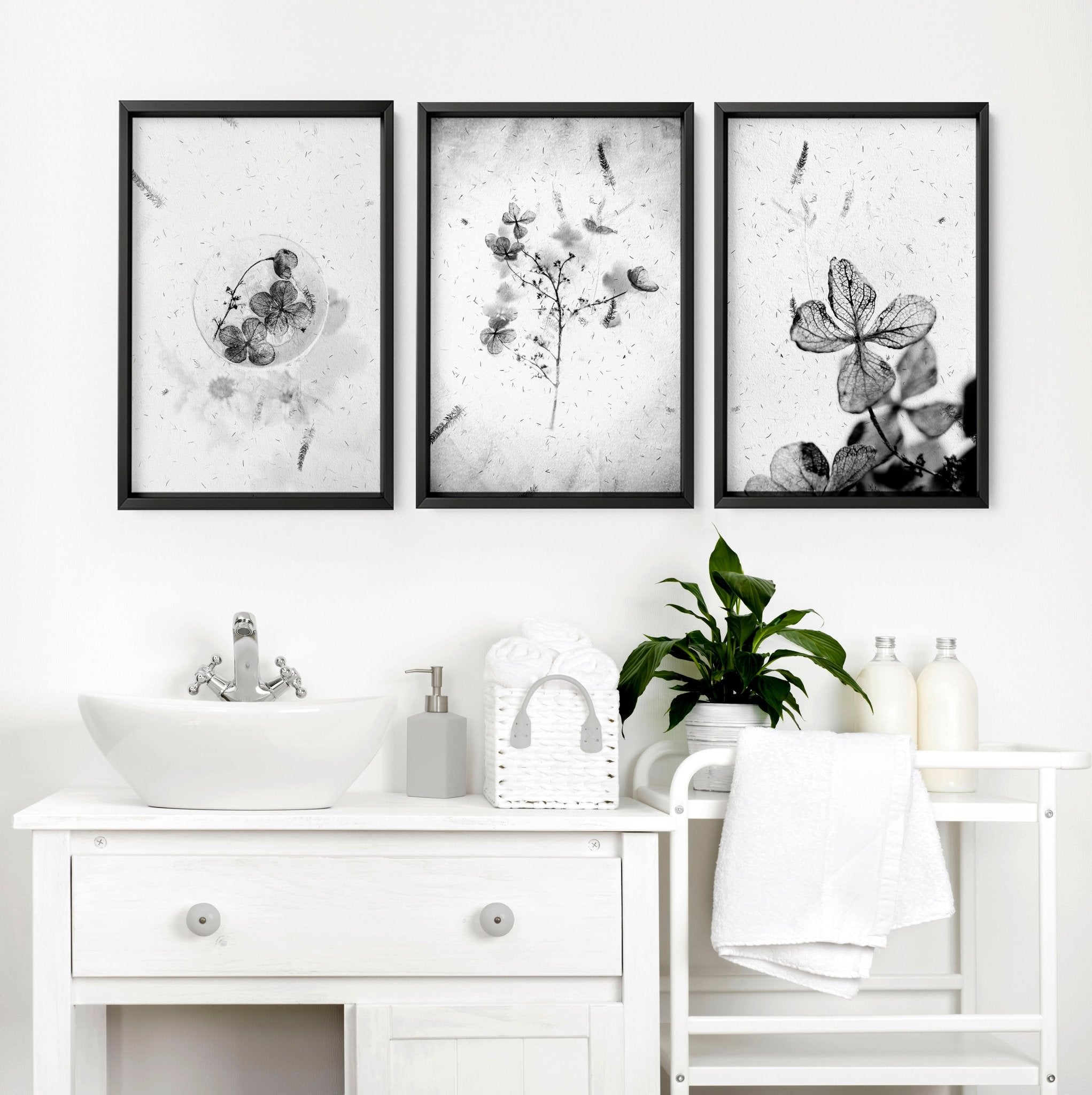 Set of 3 modern botanical wall art prints in grey, white, and black, designed for bathroom decor.