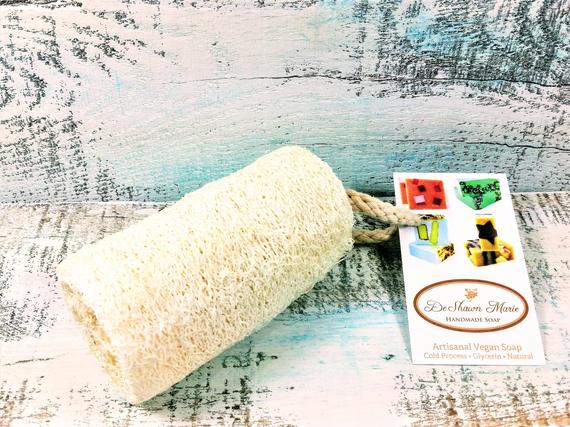 Organic Natural 4" Loofah made from luffa fibers, showcasing its natural texture and size, perfect for exfoliating skin.