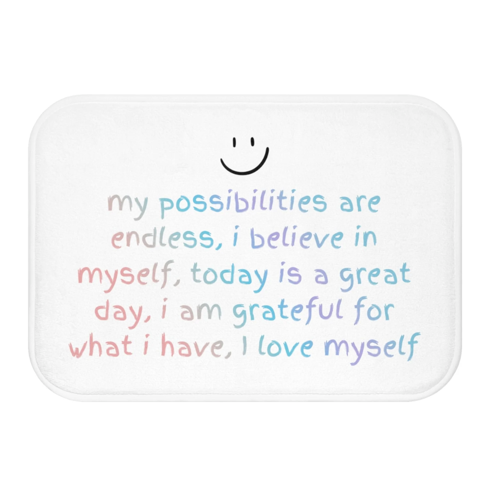 Positive Affirmation Bath Mat with anti-slip backing, featuring uplifting designs and a soft microfiber surface, perfect for bathroom safety and style.