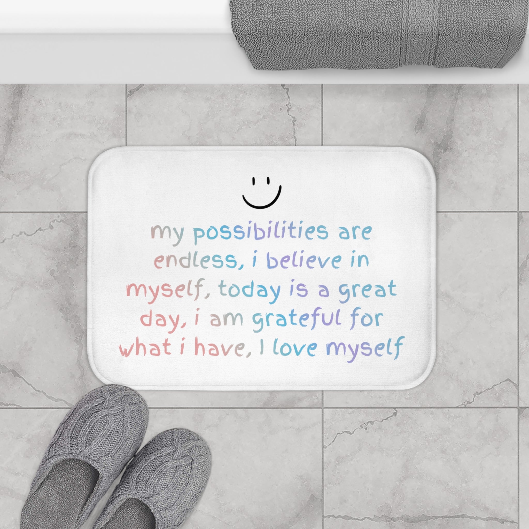 Positive Affirmation Bath Mat with anti-slip backing, featuring uplifting designs and a soft microfiber surface, perfect for bathroom safety and style.