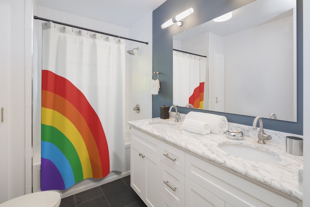 Colorful half rainbow shower curtain hanging in a bathroom, showcasing vibrant hues and a stylish design.