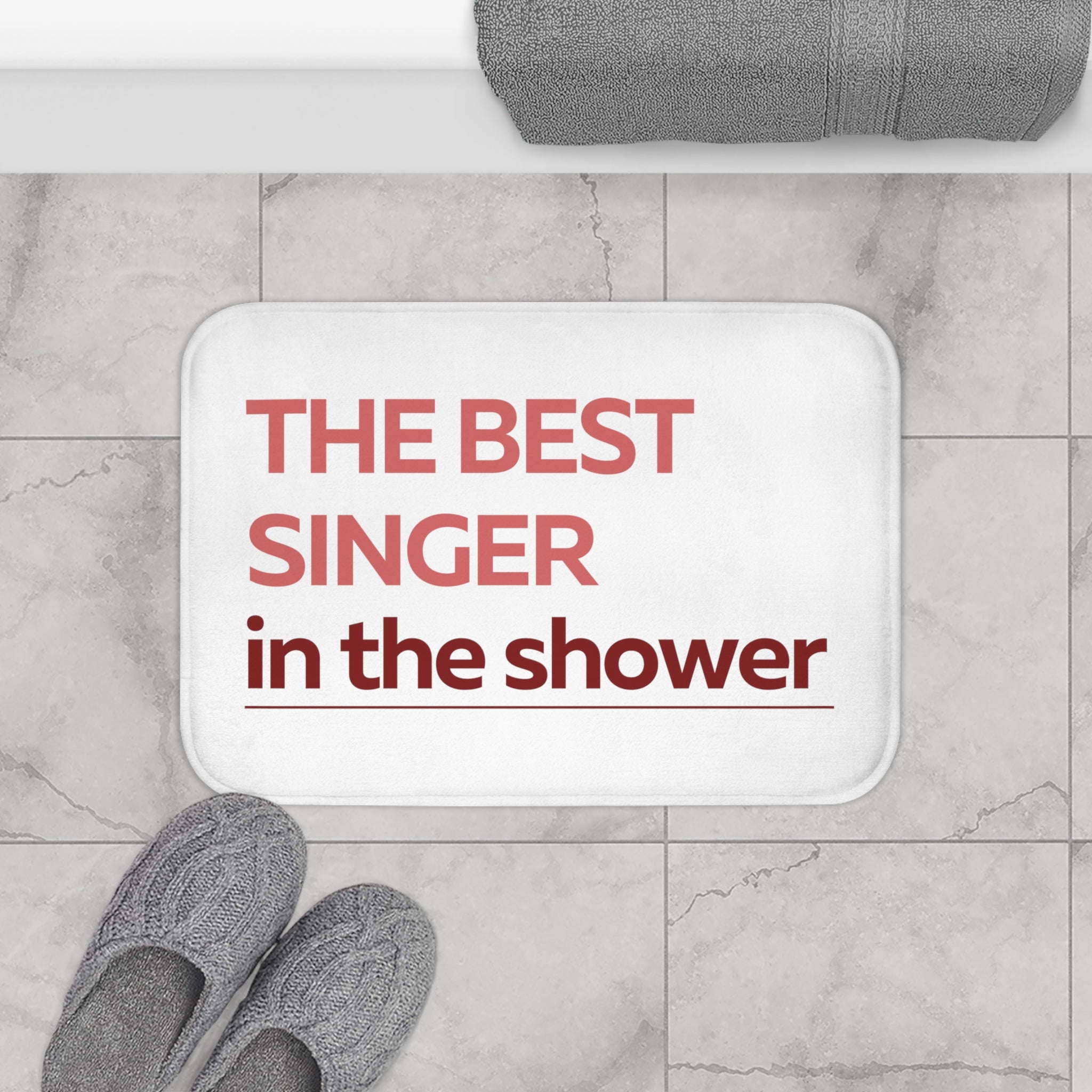 The Best Singer in The Shower Red Bath Mat with anti-slip backing, showcasing its vibrant red color and plush microfiber texture.