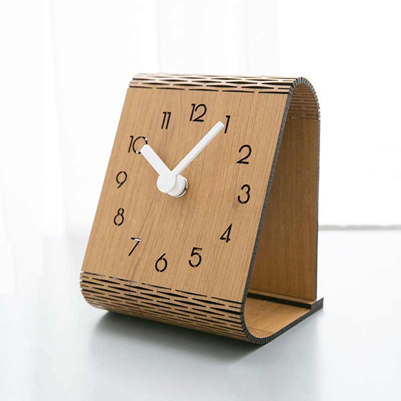 Bent Wood Clock featuring a minimalist design with Arabic numerals, crafted from Medium Density Fiberboard, ideal for silent operation.