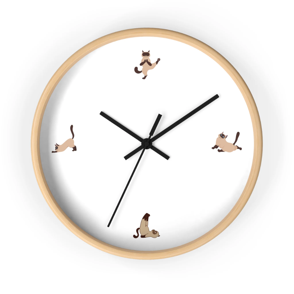 A whimsical wall clock featuring a cat doing yoga poses, set in a wooden frame with a clear plexiglass face, perfect for indoor decor.