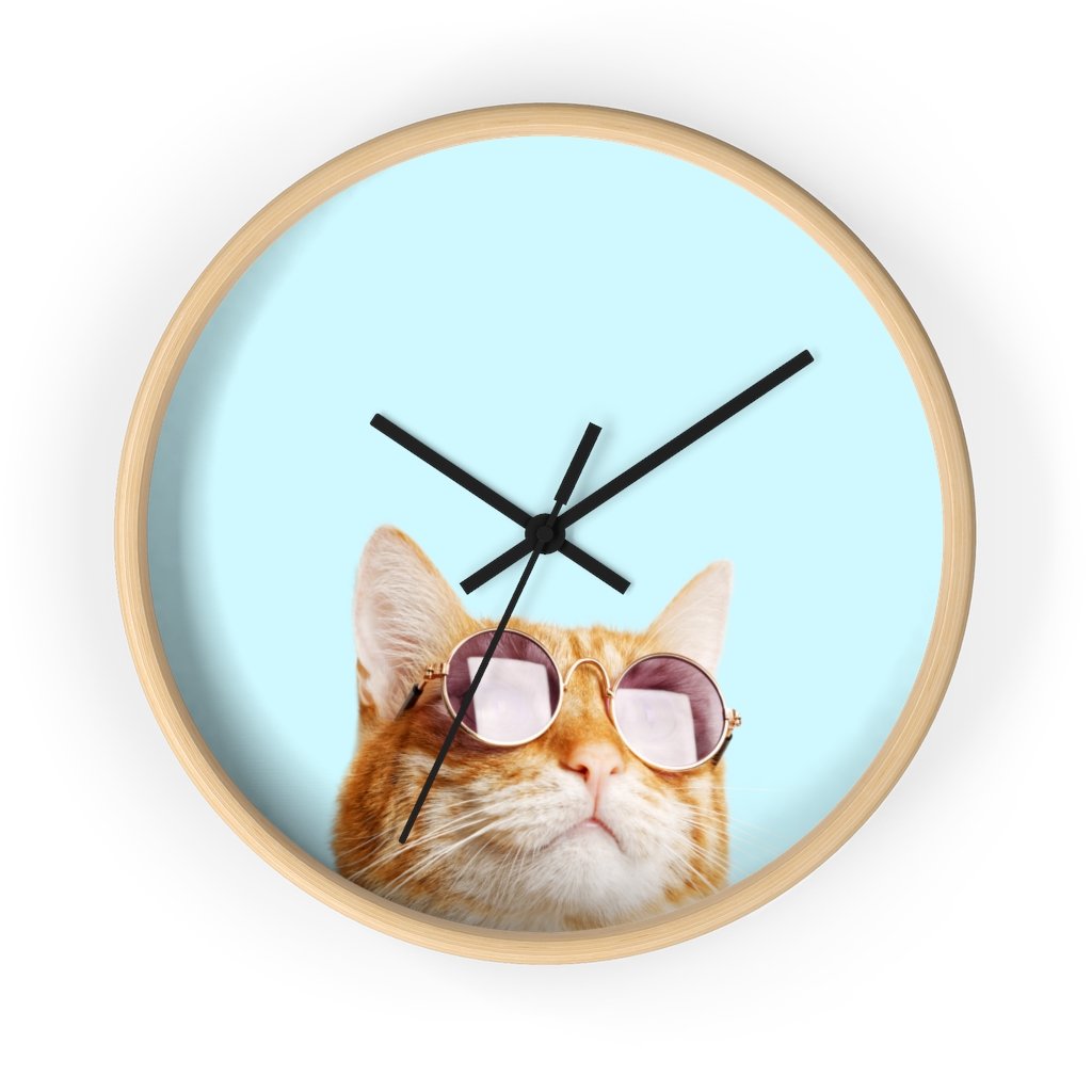 A whimsical wall clock featuring a cat design with a wooden frame and plexiglass face, ideal for indoor use.