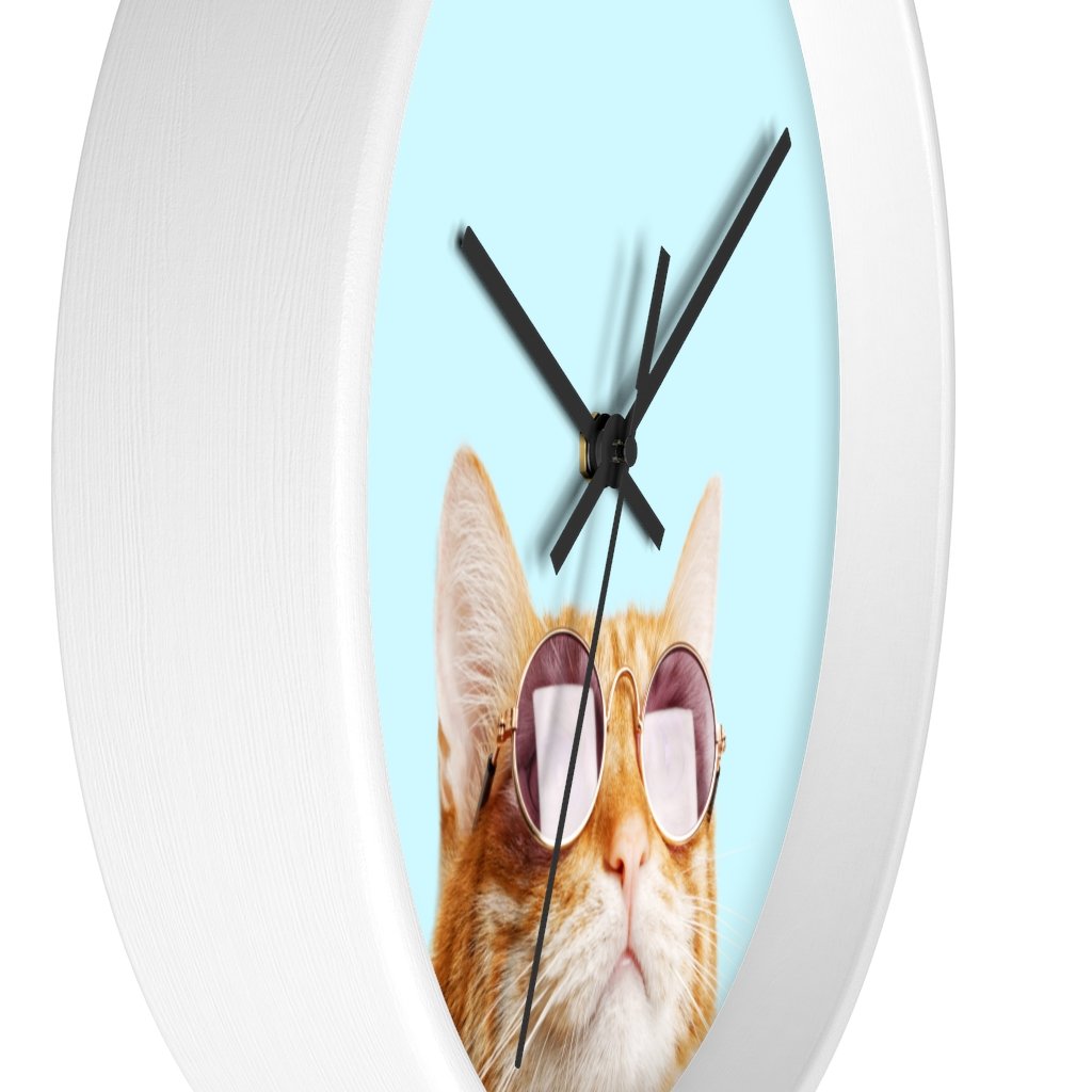 A whimsical wall clock featuring a cat design with a wooden frame and plexiglass face, ideal for indoor use.