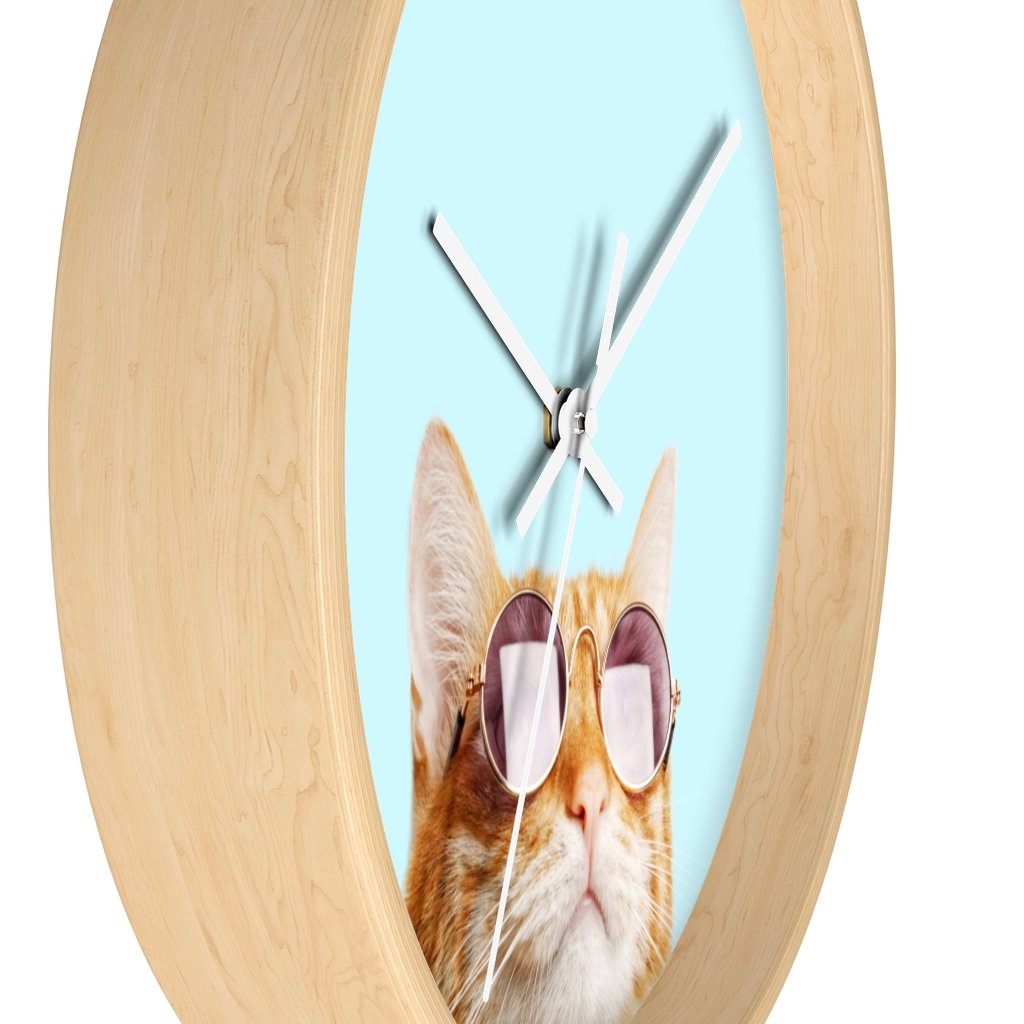 A whimsical wall clock featuring a cat design with a wooden frame and plexiglass face, ideal for indoor use.