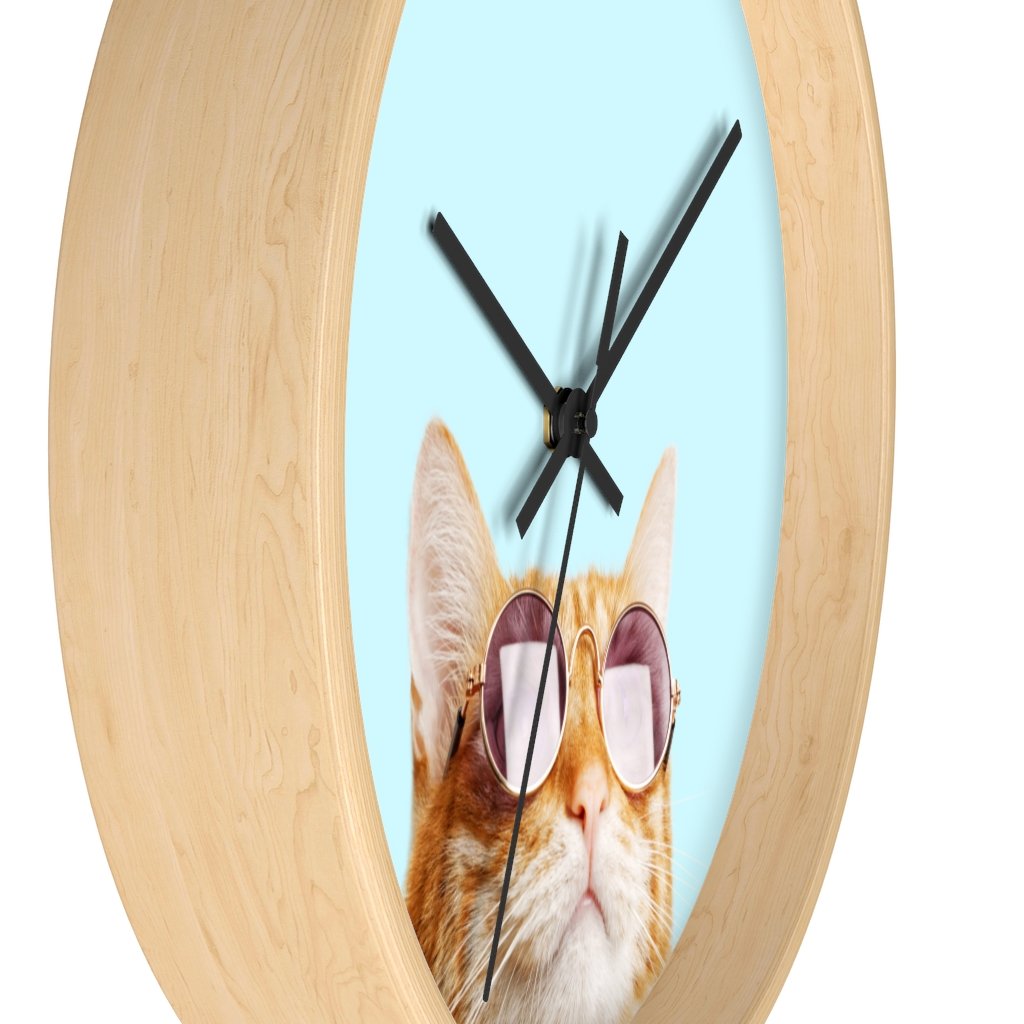 A whimsical wall clock featuring a cat design with a wooden frame and plexiglass face, ideal for indoor use.