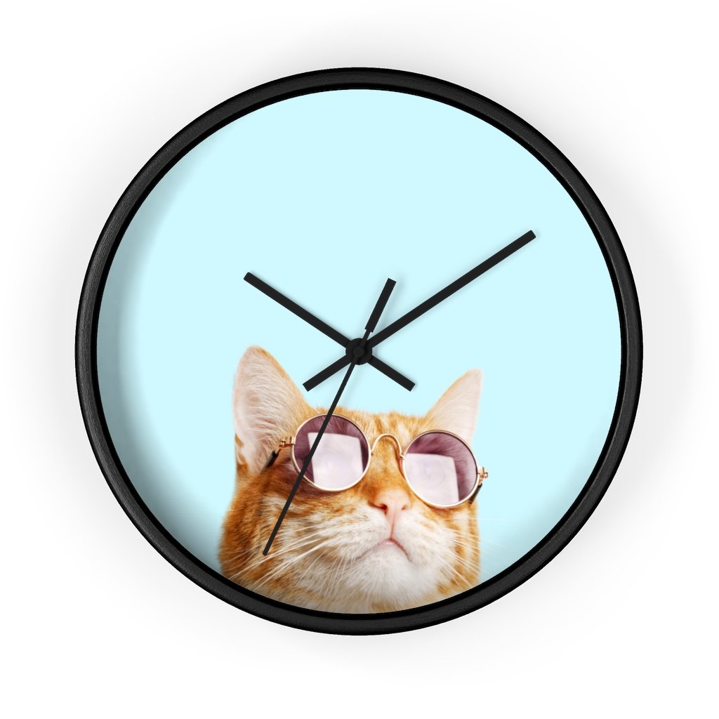 A whimsical wall clock featuring a cat design with a wooden frame and plexiglass face, ideal for indoor use.