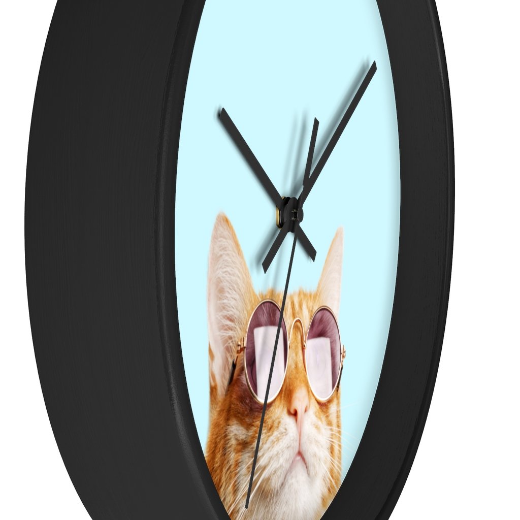 A whimsical wall clock featuring a cat design with a wooden frame and plexiglass face, ideal for indoor use.