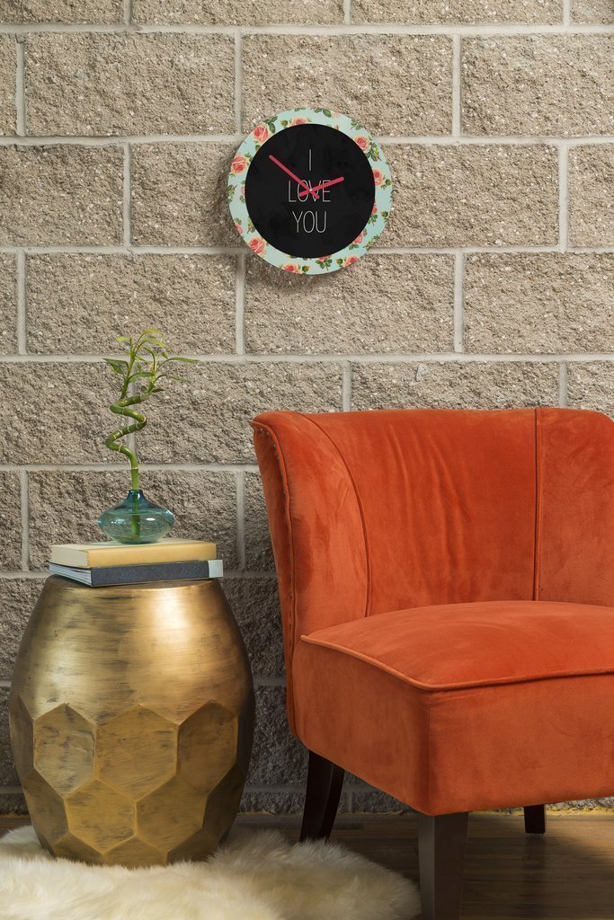 A beautifully designed 12-inch round wall clock featuring floral artwork and coordinating clock hands, perfect for home décor.