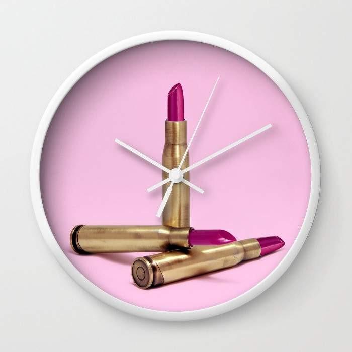 LIPSTICK BULLET Wall Clock with black or white frame, featuring a high-impact plexiglass face and stylish clock hands.