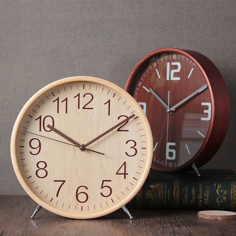 A sleek Minimalist Style Wood Clock made from natural wood, featuring a silent mechanism and a simple, elegant design suitable for any decor.