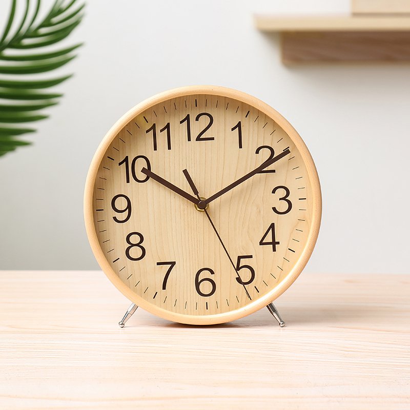 A sleek Minimalist Style Wood Clock made from natural wood, featuring a silent mechanism and a simple, elegant design suitable for any decor.