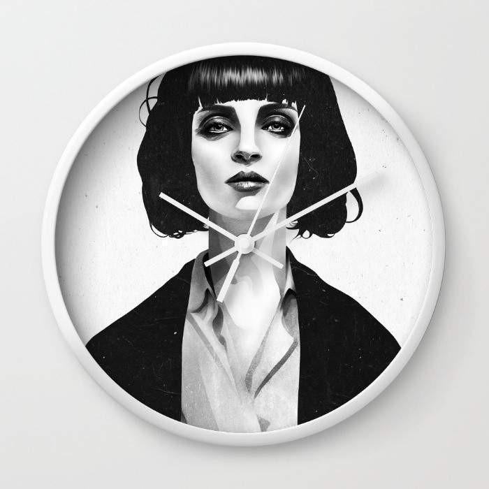 Mrs Mia Wallace Wall Clock with black and white frame options, featuring a clear plexiglass face and stylish clock hands.