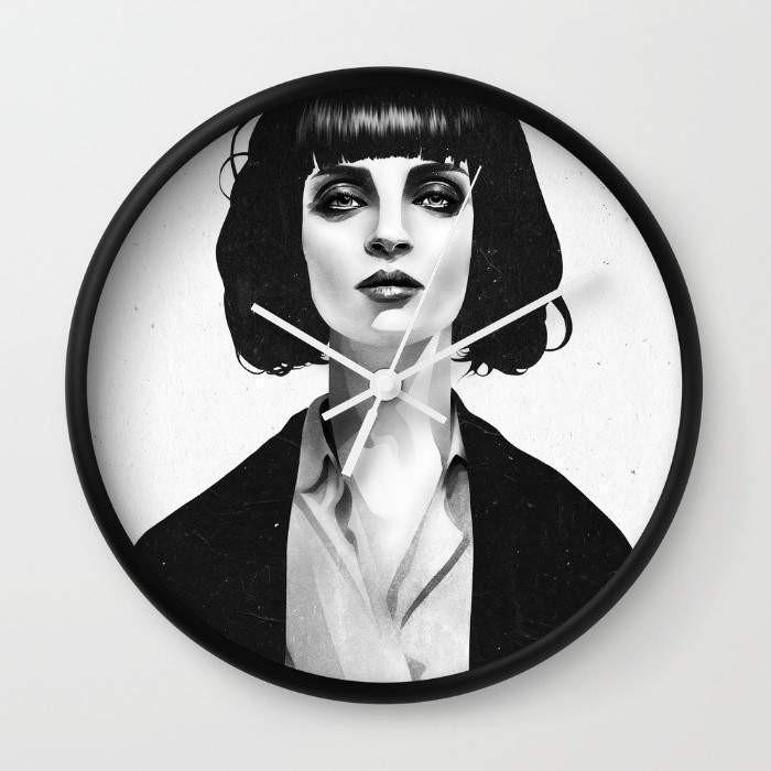 Mrs Mia Wallace Wall Clock with black and white frame options, featuring a clear plexiglass face and stylish clock hands.