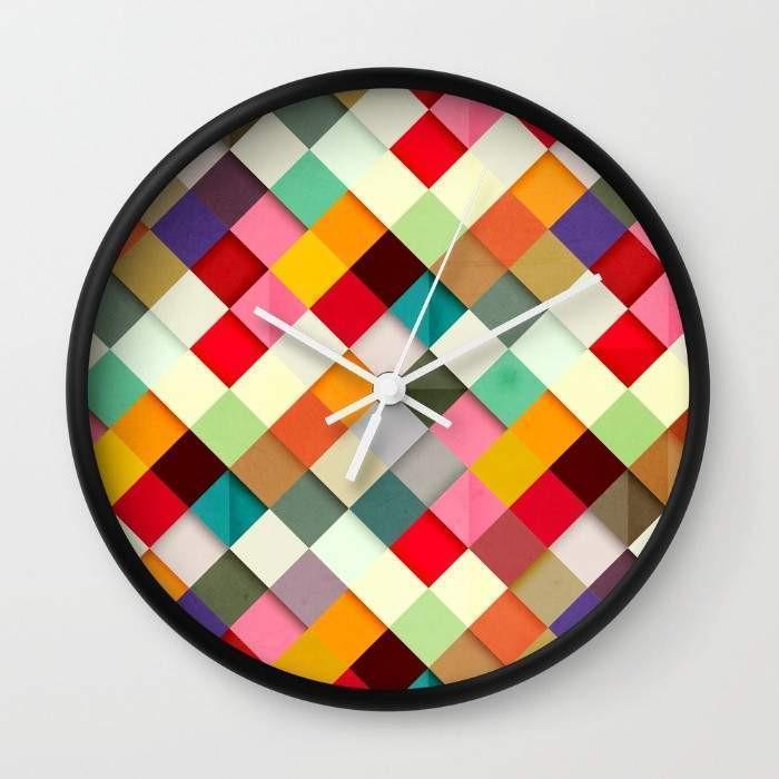 Pass this On Wall Clock in black and white frames, featuring a clear plexiglass face and stylish hands, perfect for any home decor.