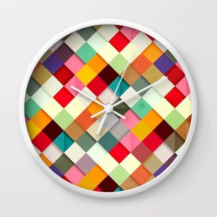 Pass this On Wall Clock in black and white frames, featuring a clear plexiglass face and stylish hands, perfect for any home decor.