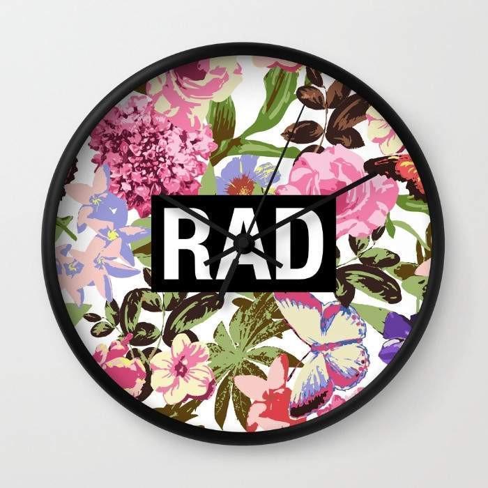 Rad Wall Clock featuring a 10-inch diameter with black or white frame options and a high-impact plexiglass crystal face.