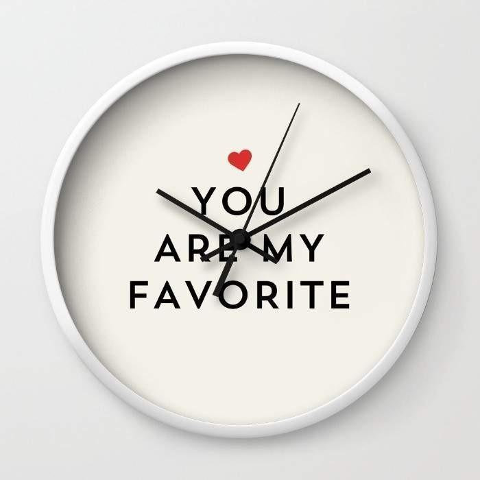 YOU ARE MY FAVORITE Wall Clock in black frame with clear plexiglass face and black hands, showcasing a unique design.