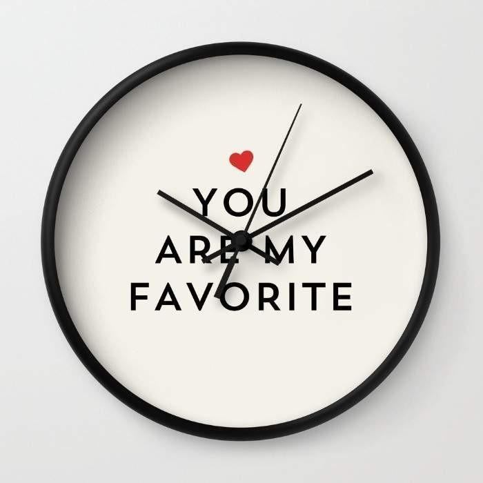 YOU ARE MY FAVORITE Wall Clock in black frame with clear plexiglass face and black hands, showcasing a unique design.