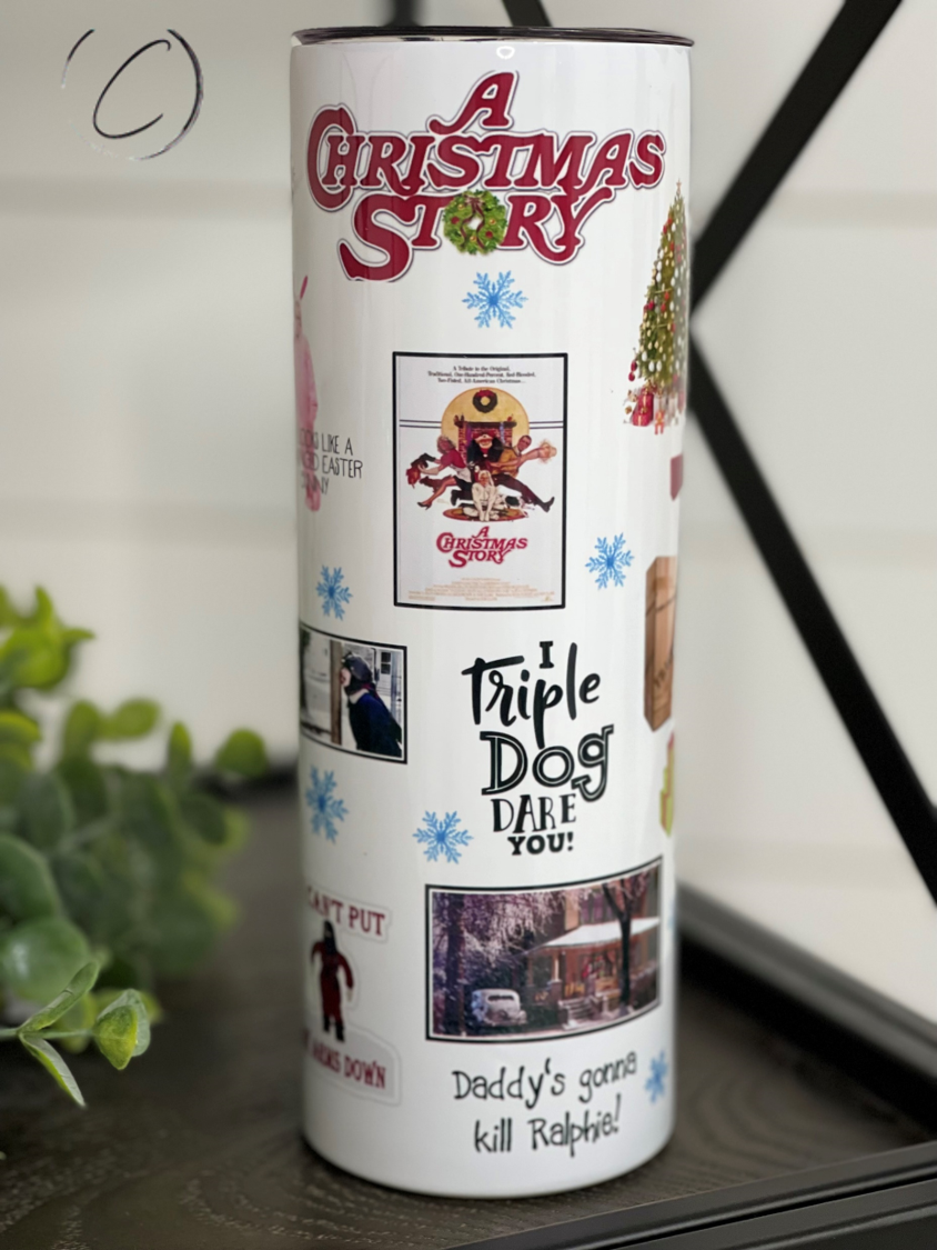 A Christmas Story 20oz Skinny Tumbler featuring a festive design, reusable straw, and high-quality construction.