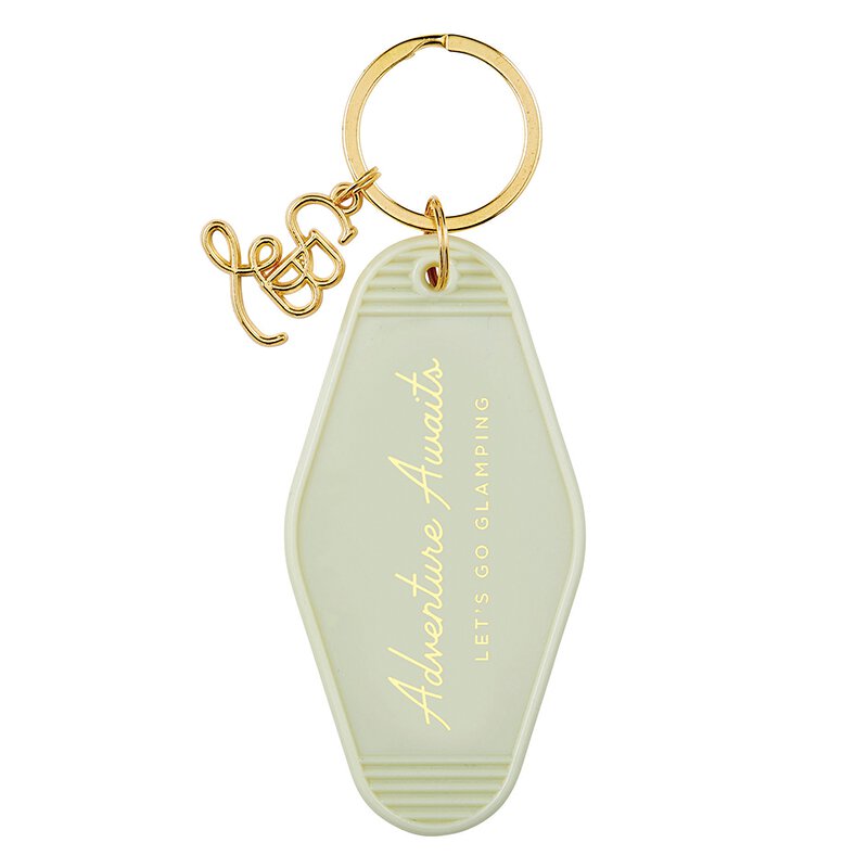 Light green vintage motel keychain with gold hardware and text 'Adventure Awaits, Let's Go Glamping'.