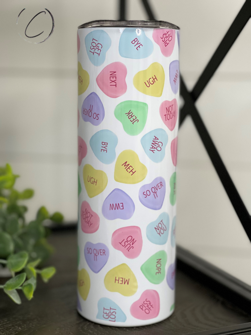 Anti Valentines Conversation Hearts 20oz Skinny Tumbler with colorful heart designs, featuring a reusable straw.