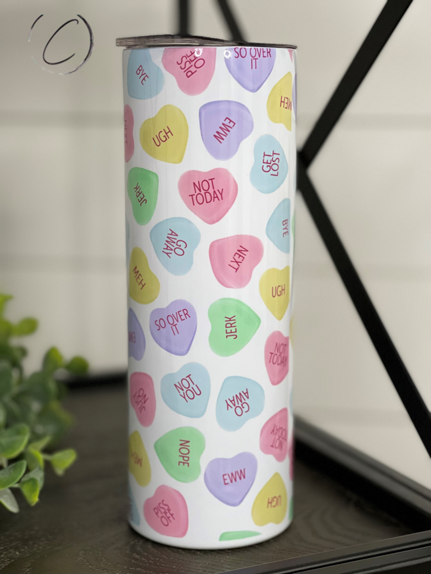 Anti Valentines Conversation Hearts 20oz Skinny Tumbler with colorful heart designs, featuring a reusable straw.