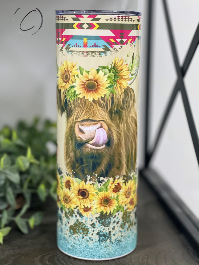 Aztec Sunflower Highland Cow 20oz Skinny Tumbler featuring a vibrant sunflower design and Highland cow image.