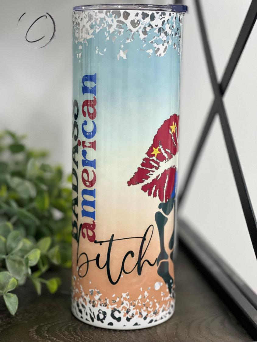 Badass American B**** 20oz Skinny Tumbler with a vibrant full wrap design and reusable straw.