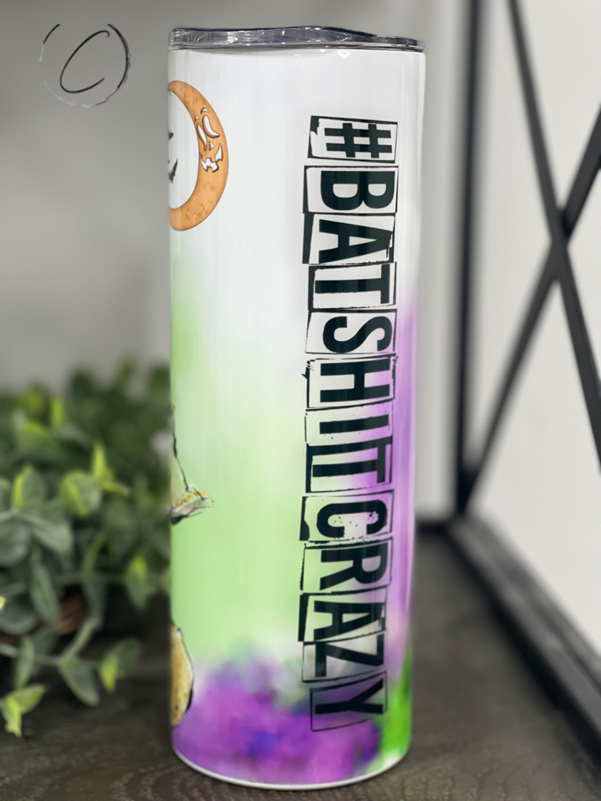 A stylish #BatShitCrazy 20oz skinny tumbler featuring a vibrant full wrap design, perfect for hot and cold beverages.