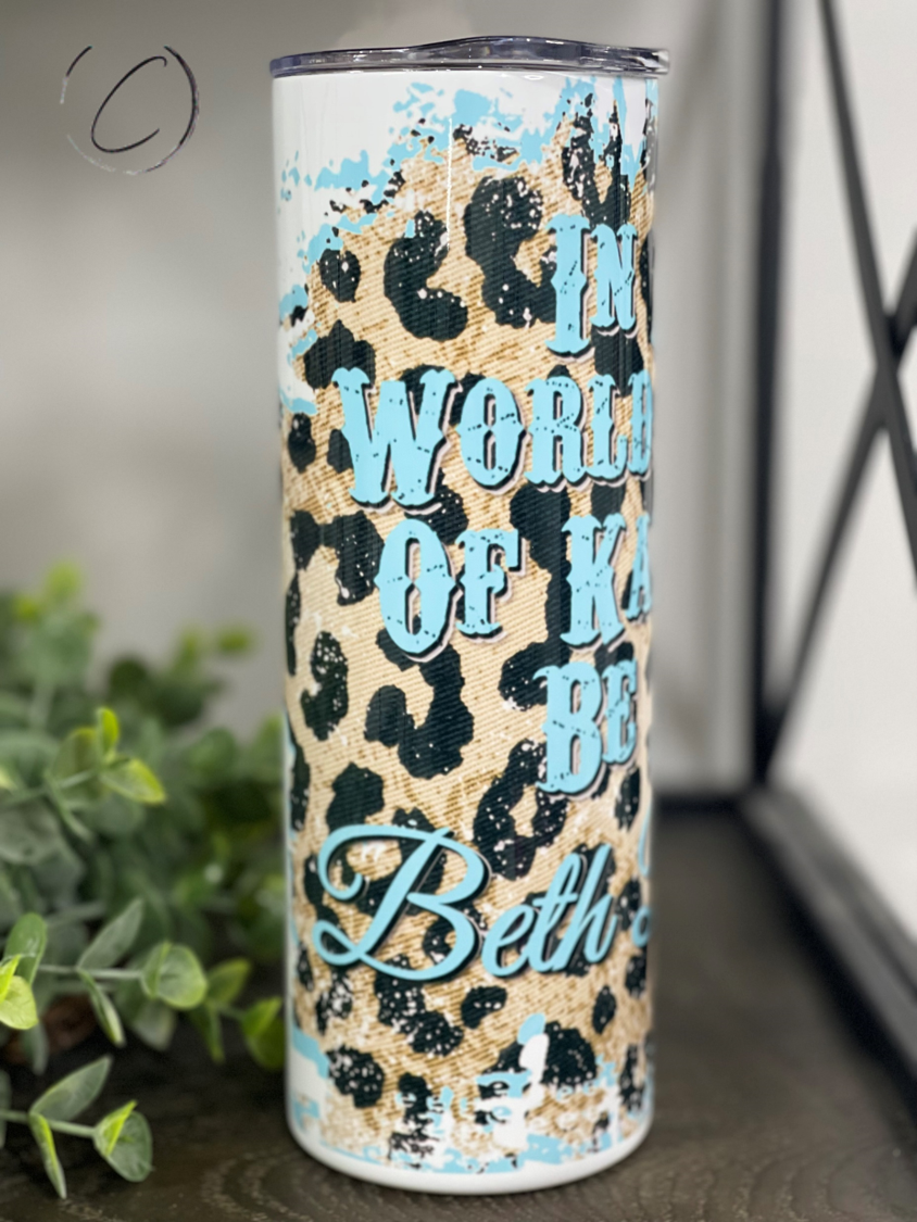 Be A Beth Dutton 20oz Skinny Tumbler featuring a full wrap design with vibrant colors and a reusable straw.