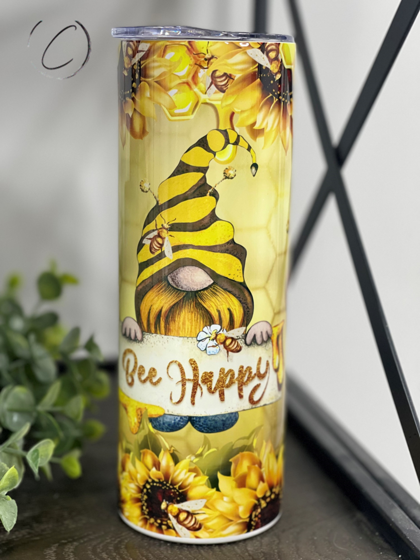 Bee Happy Gnomes 20oz Skinny Tumbler featuring a whimsical gnome design, perfect for hot and cold beverages.