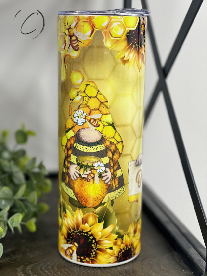 Bee Happy Gnomes 20oz Skinny Tumbler featuring a whimsical gnome design, perfect for hot and cold beverages.