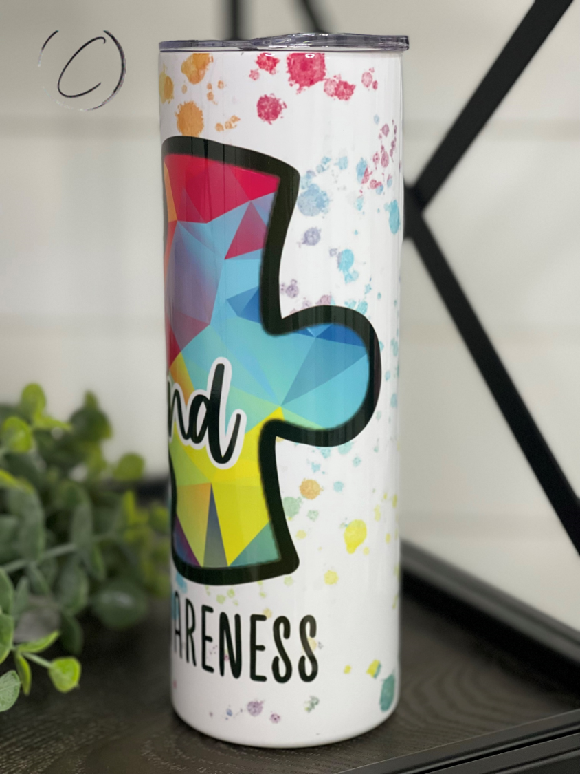 Be Kind Autism Awareness 20oz Skinny Tumbler with vibrant full wrap design and reusable straw.