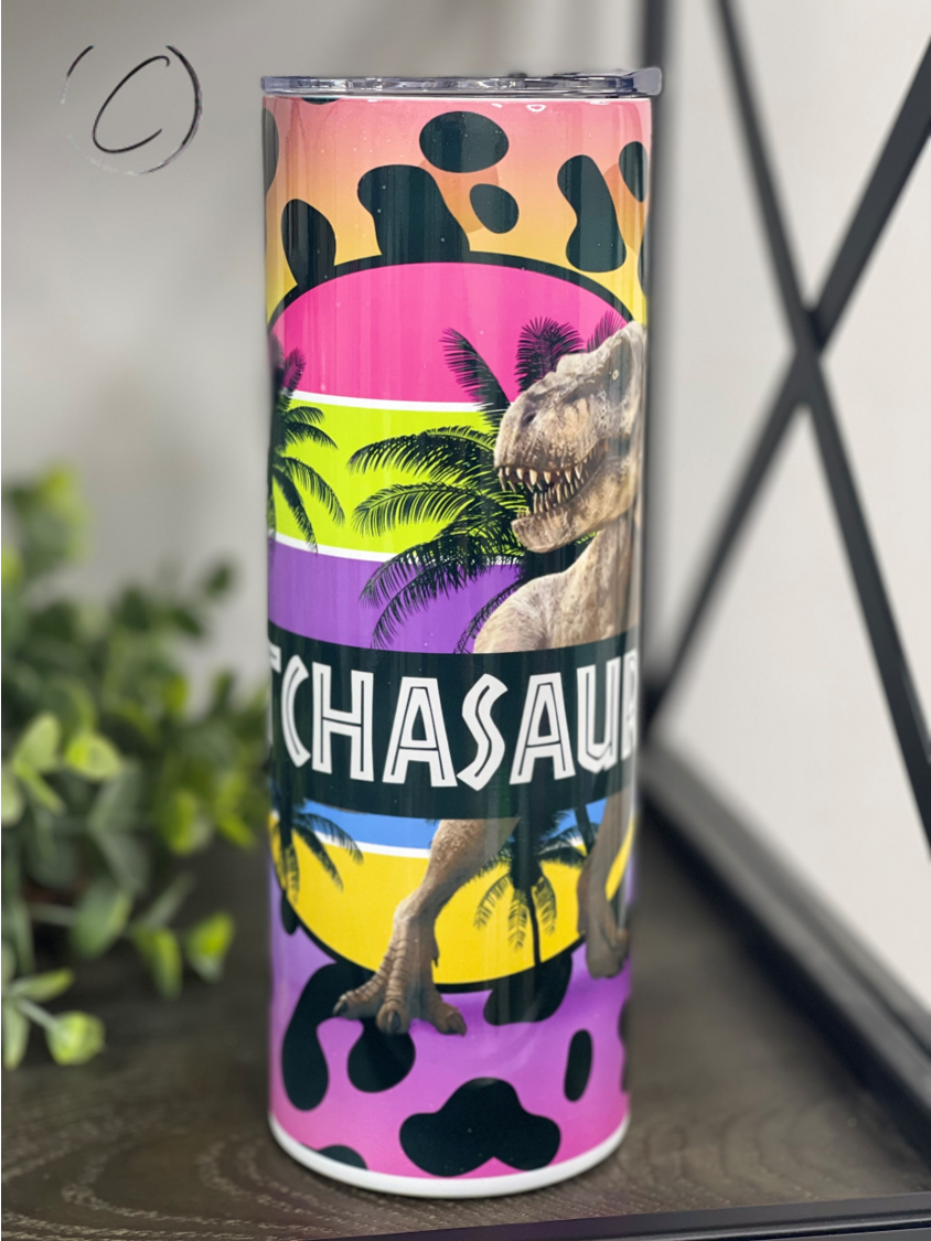 Bitchasaurus 20oz Skinny Tumbler with vibrant design and reusable straw, showcasing its durable construction.