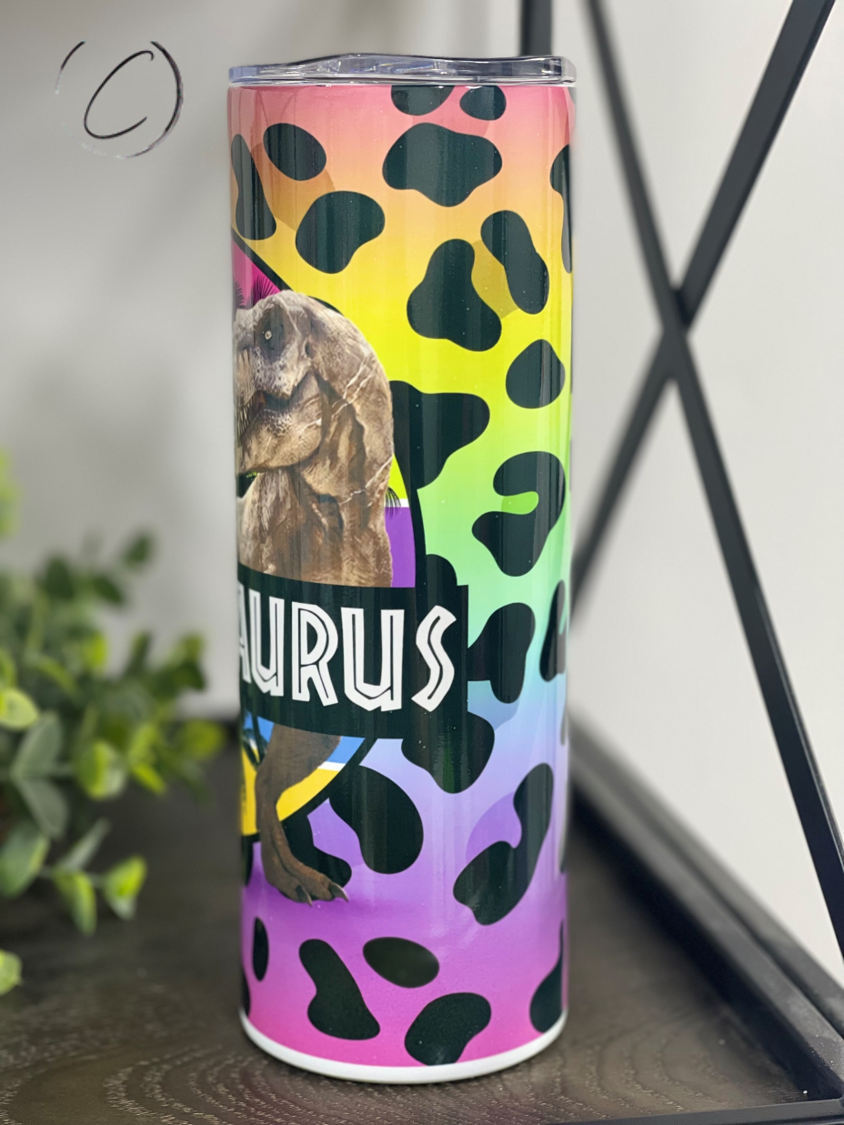 Bitchasaurus 20oz Skinny Tumbler with vibrant design and reusable straw, showcasing its durable construction.