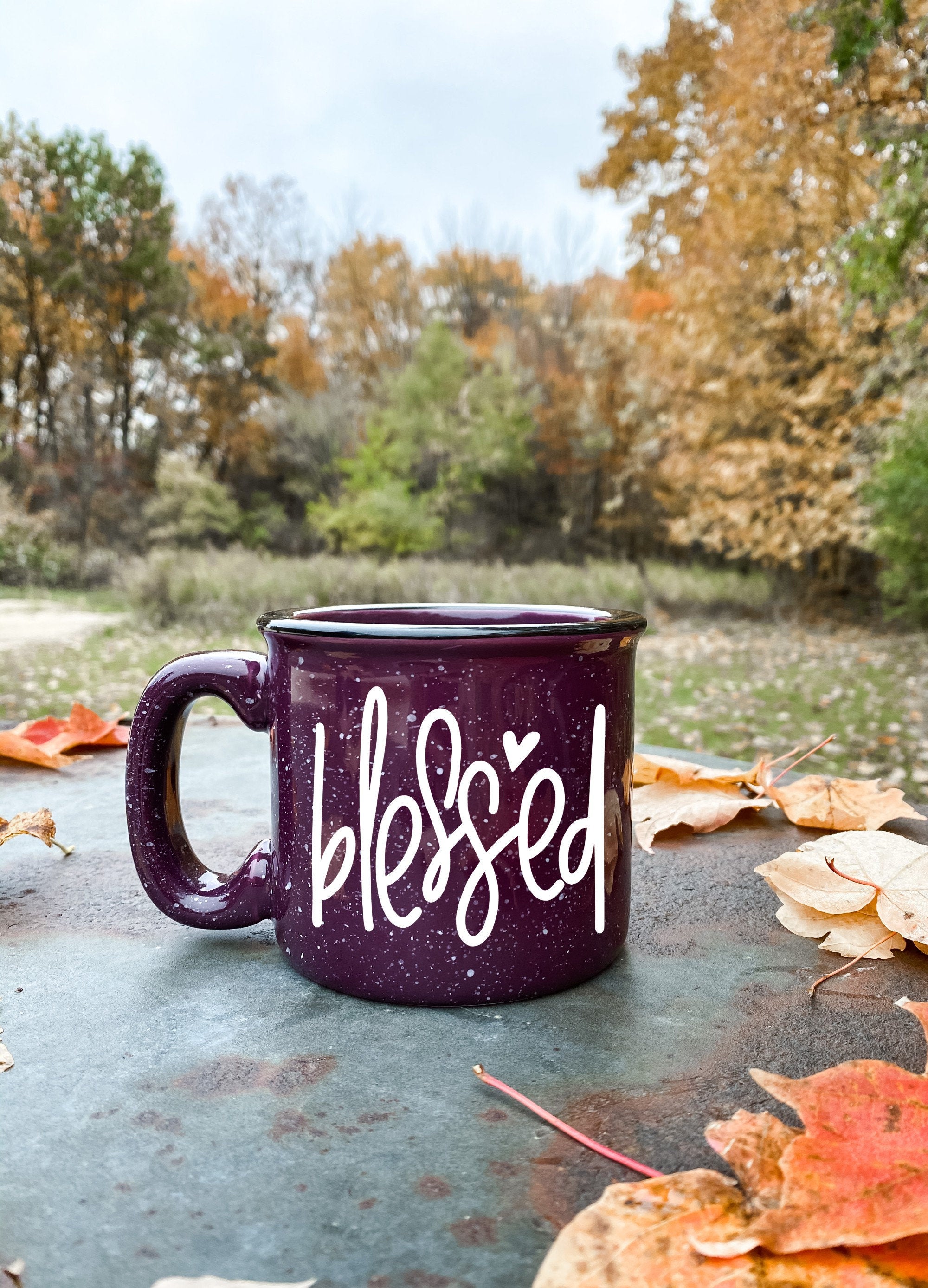 A stylish Blessed Campfire Mug with a unique design, perfect for enjoying hot beverages outdoors or at home.