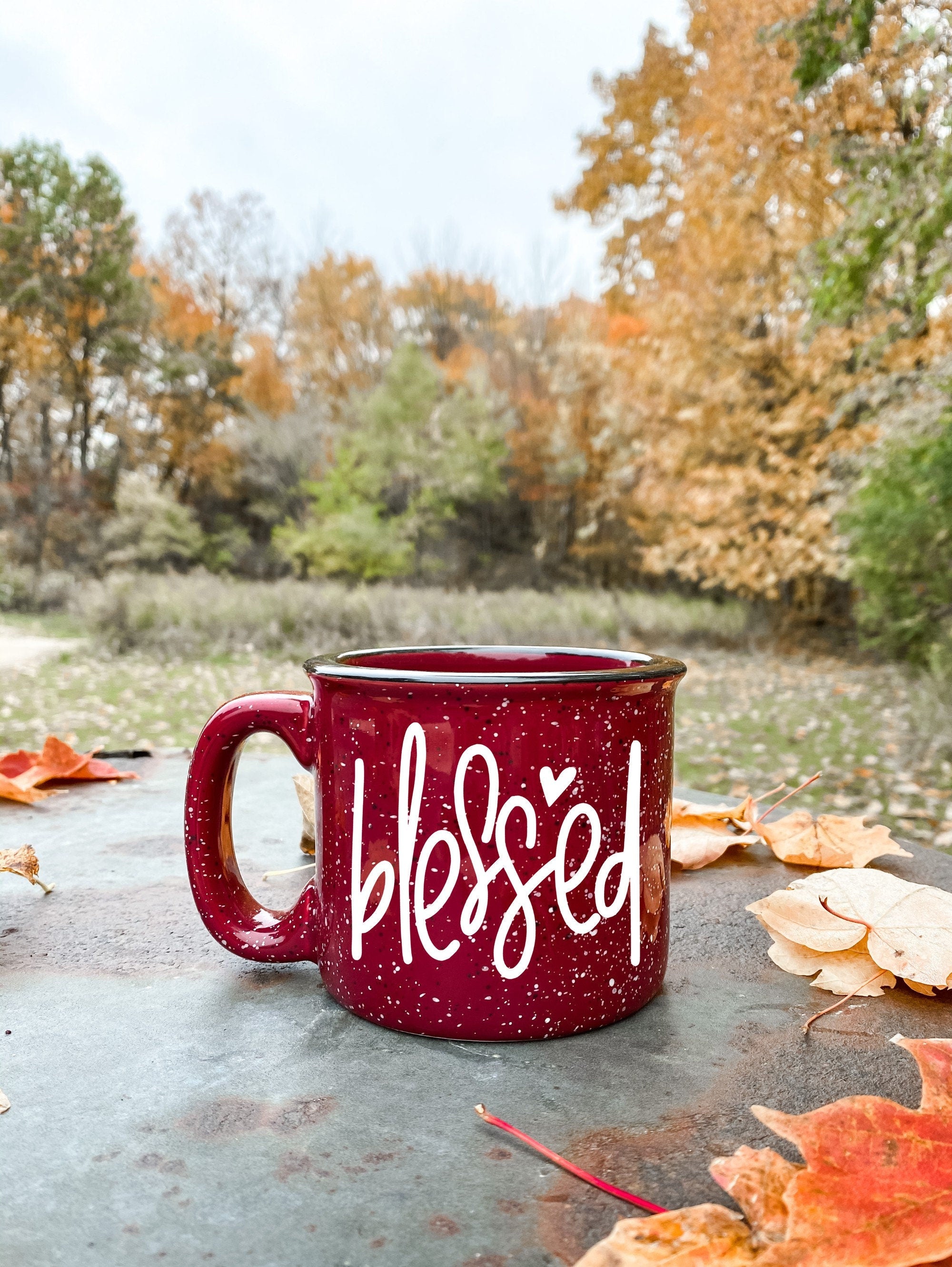 A stylish Blessed Campfire Mug with a unique design, perfect for enjoying hot beverages outdoors or at home.