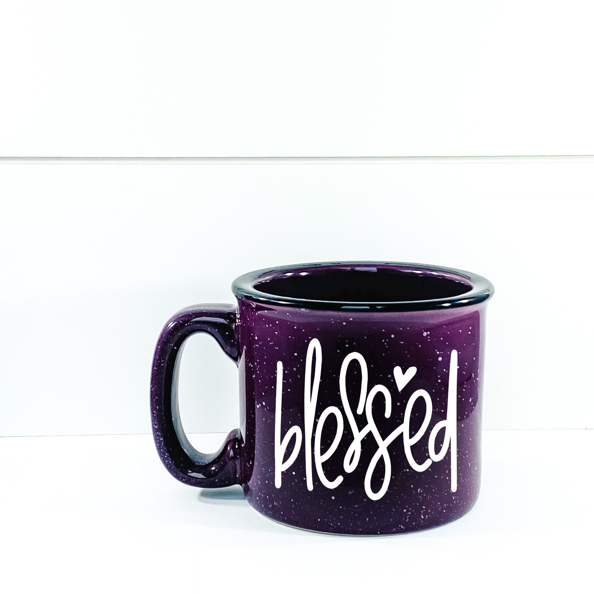 A stylish Blessed Campfire Mug with a unique design, perfect for enjoying hot beverages outdoors or at home.