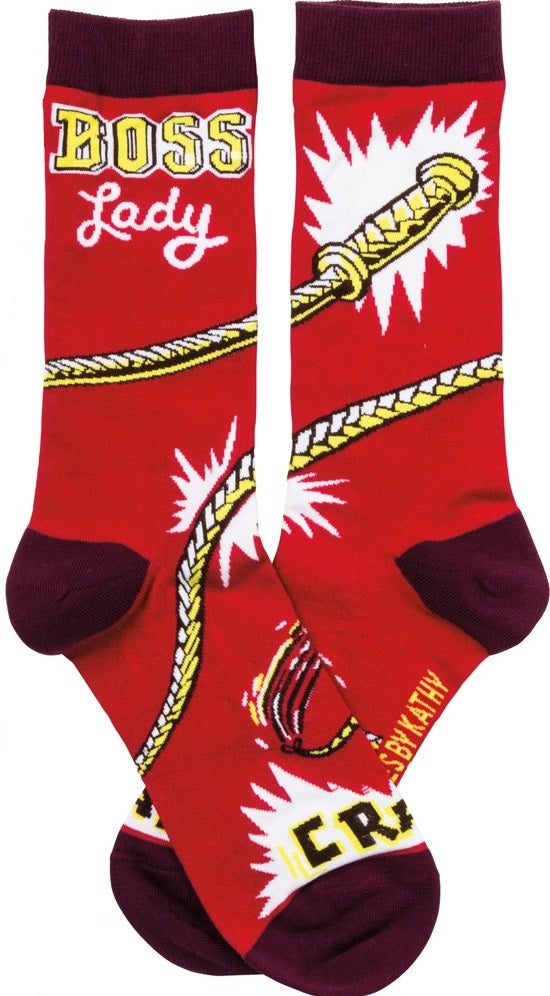 A pair of vibrant red socks with 'Boss Lady' and 'Crack!' printed on them, showcasing a fun and empowering design.