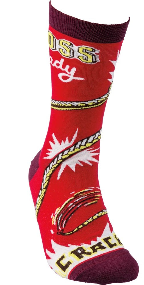 A pair of vibrant red socks with 'Boss Lady' and 'Crack!' printed on them, showcasing a fun and empowering design.