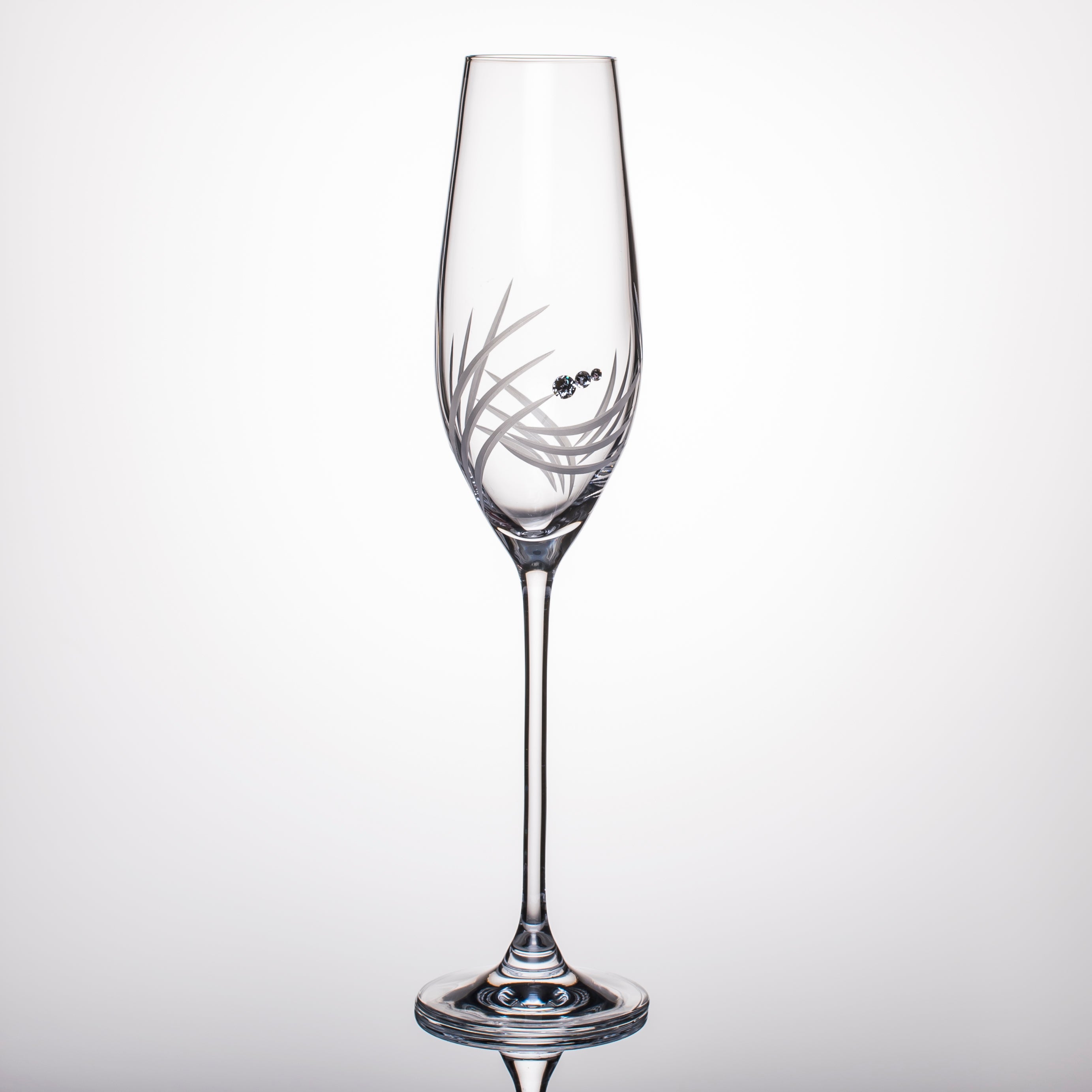 Set of 2 elegant Breeze Champagne Glasses with Swarovski crystals in a luxurious gift box, showcasing exquisite hand-cut designs.