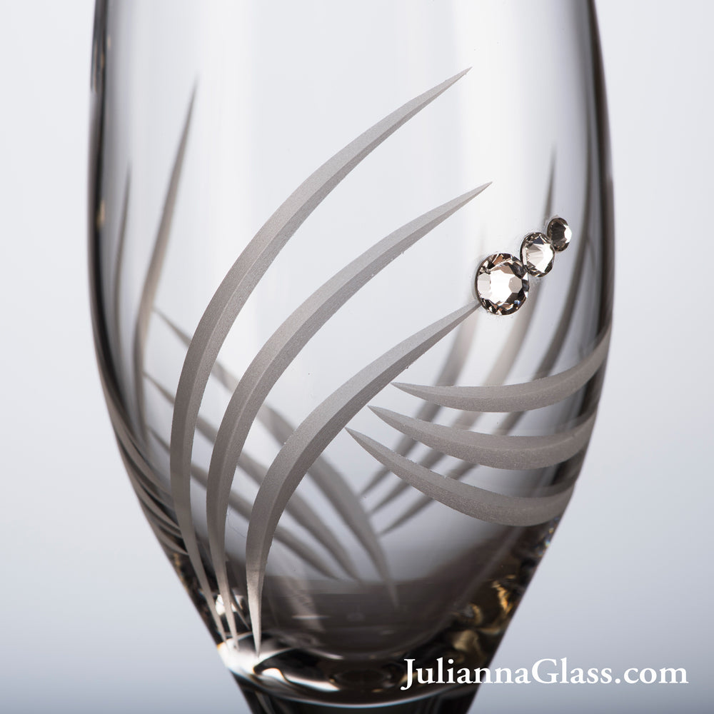 Set of 2 elegant Breeze Champagne Glasses with Swarovski crystals in a luxurious gift box, showcasing exquisite hand-cut designs.